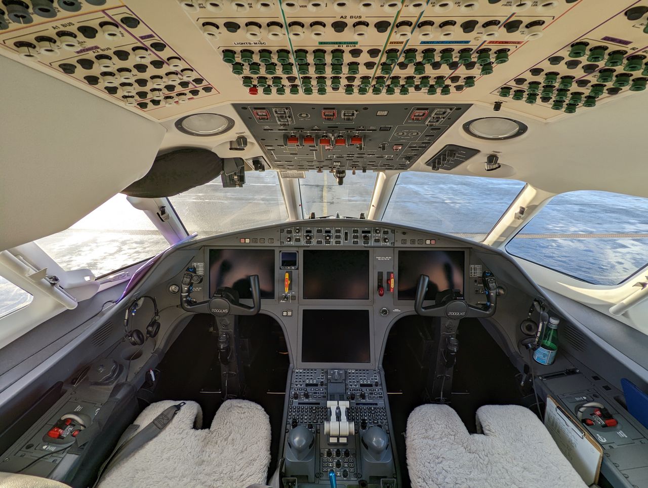 Services Detailed view of a modern aircraft cockpit showcasing flight control and navigation technologies.