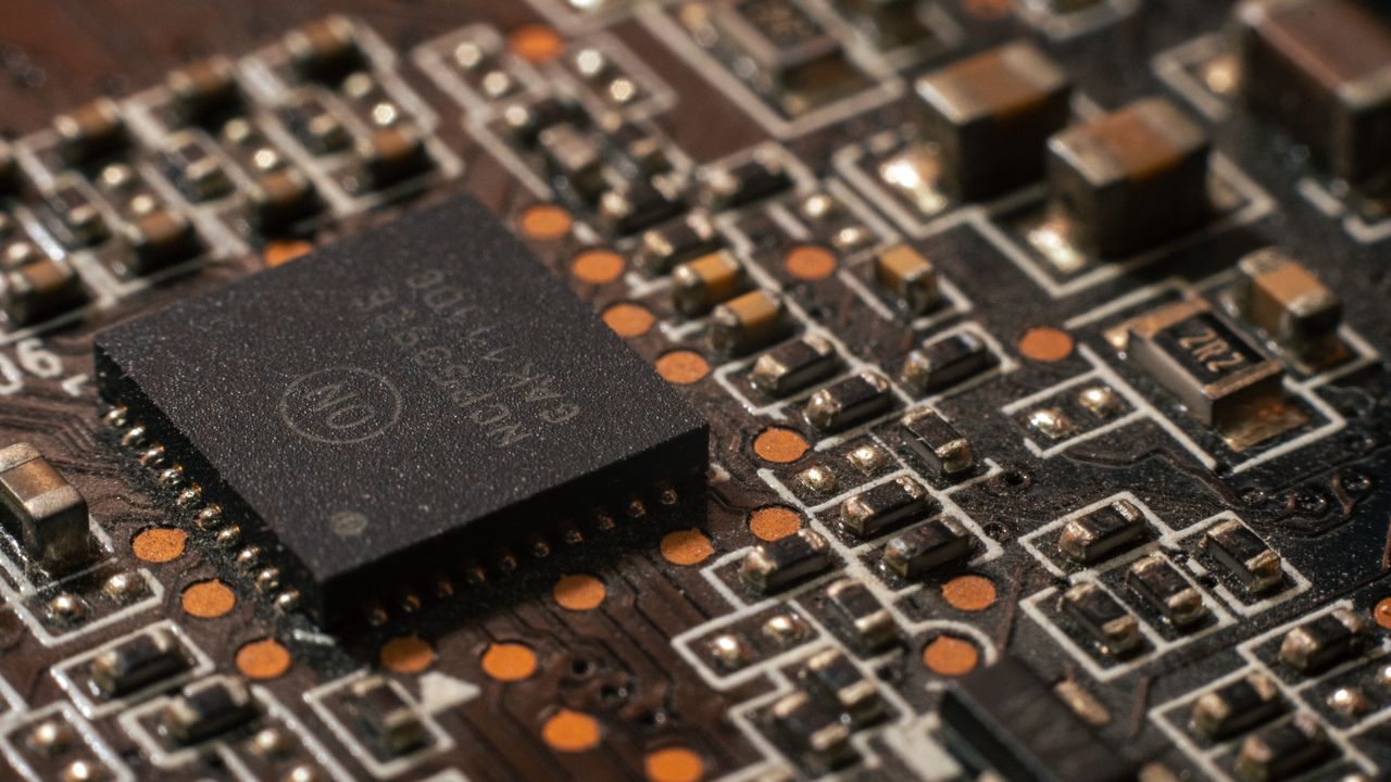 Services Detailed close-up of a computer circuit board showcasing electronic components.